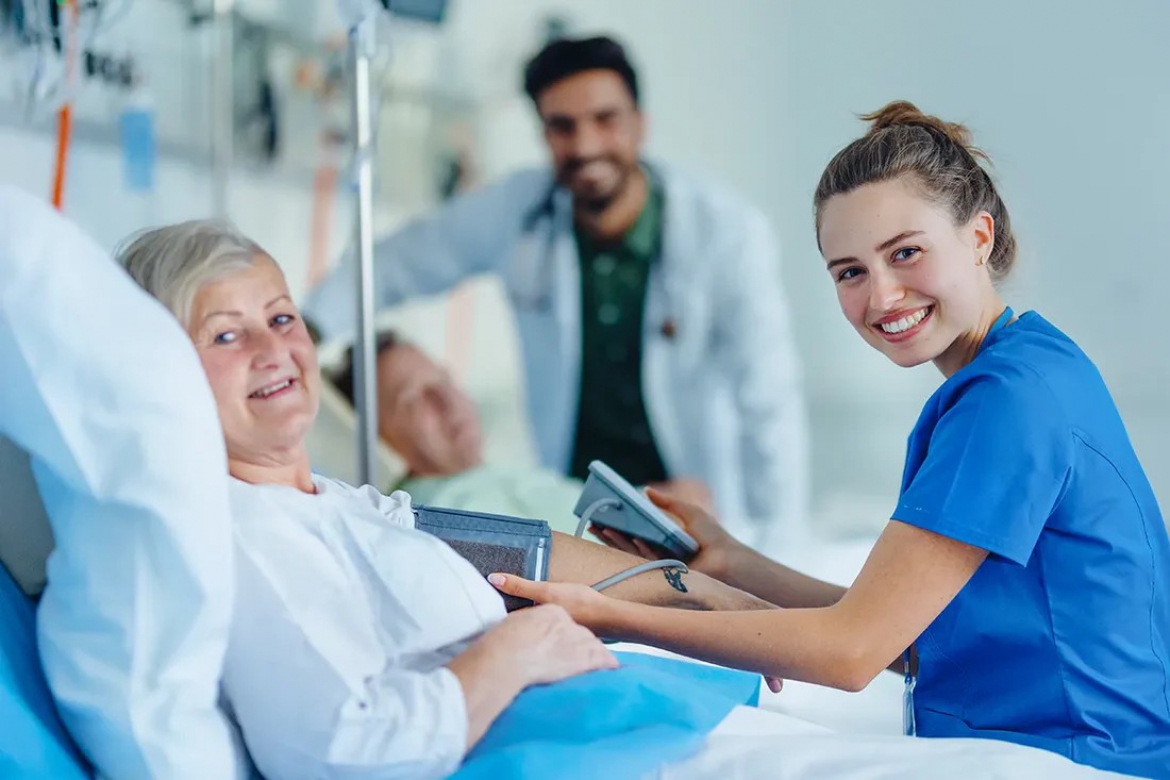 A gentle nurse providing compassionate care to an elderly patient in their home.