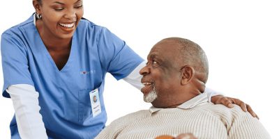 Skilled nurse assisting a patient with medication management at home in Hampden and Hampshire County areas