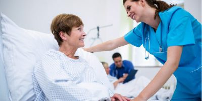 Compassionate caregiver assisting a senior with personal care needs at home.