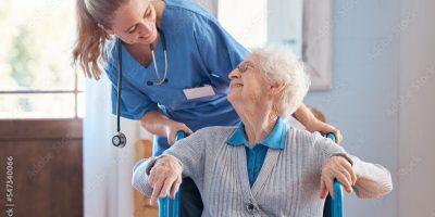 A compassionate nurse from Heal at Home Health LLC providing post-surgical care to a patient in their home.